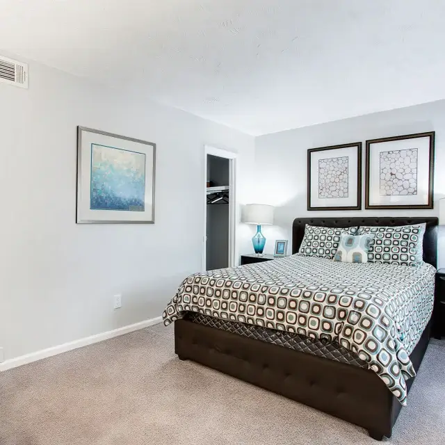 Comfortable bedroom with spacious closet and modern furnishings at Elea Apartments in Marietta, GA